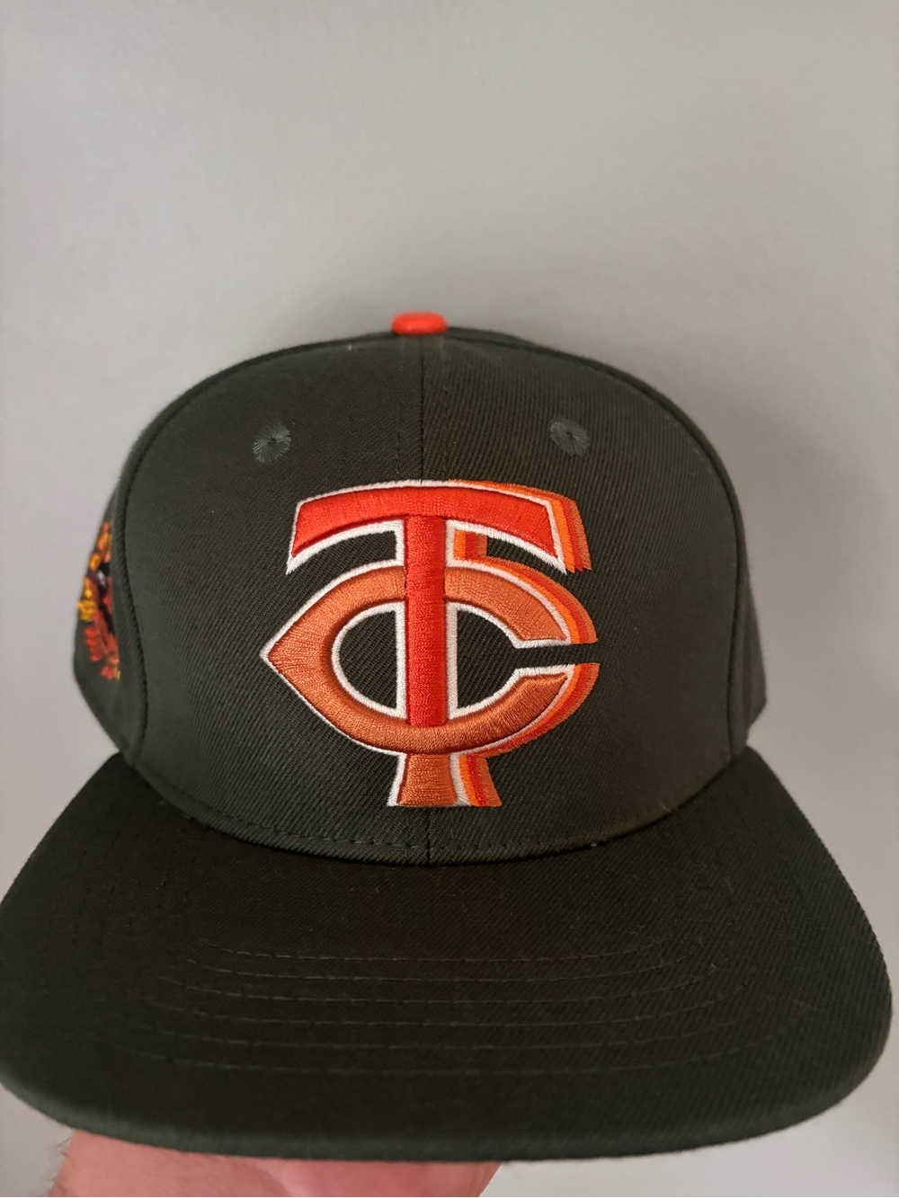 Men's Olive Green Snapback Hat with Orange Embroidered Logo
